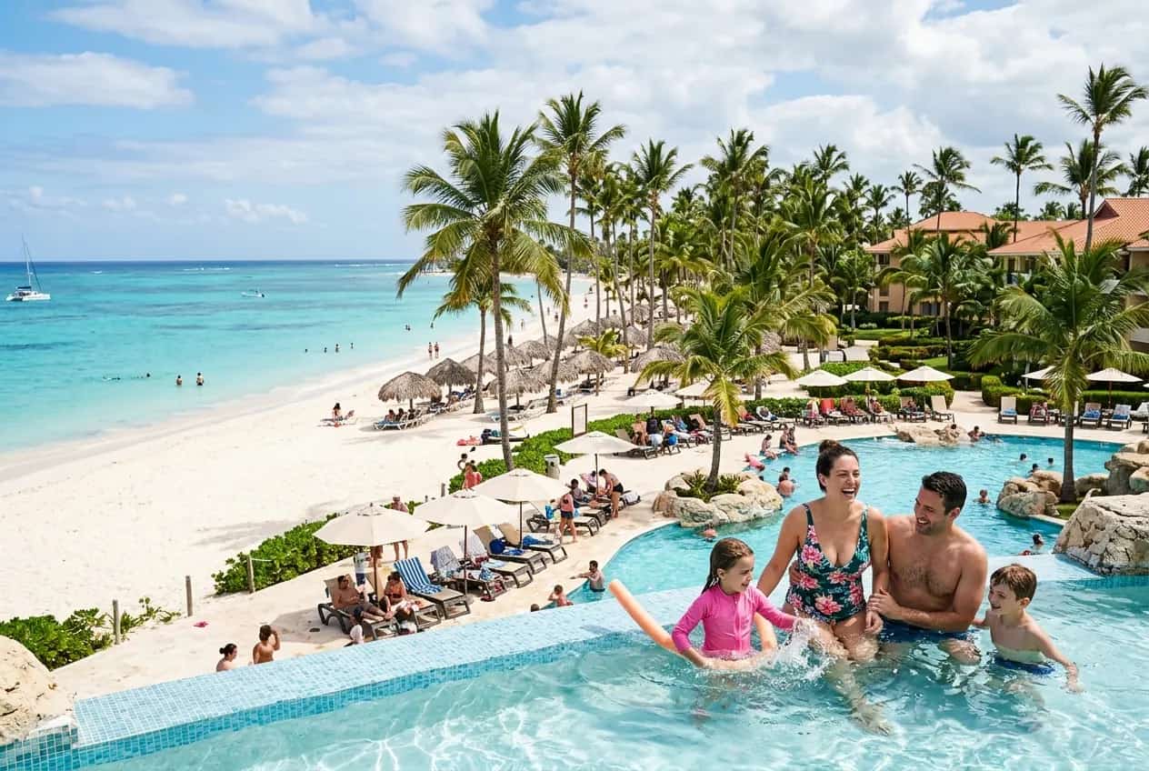Calm turquoise water at Bavaro Beach in Punta Cana with palm trees and white sand