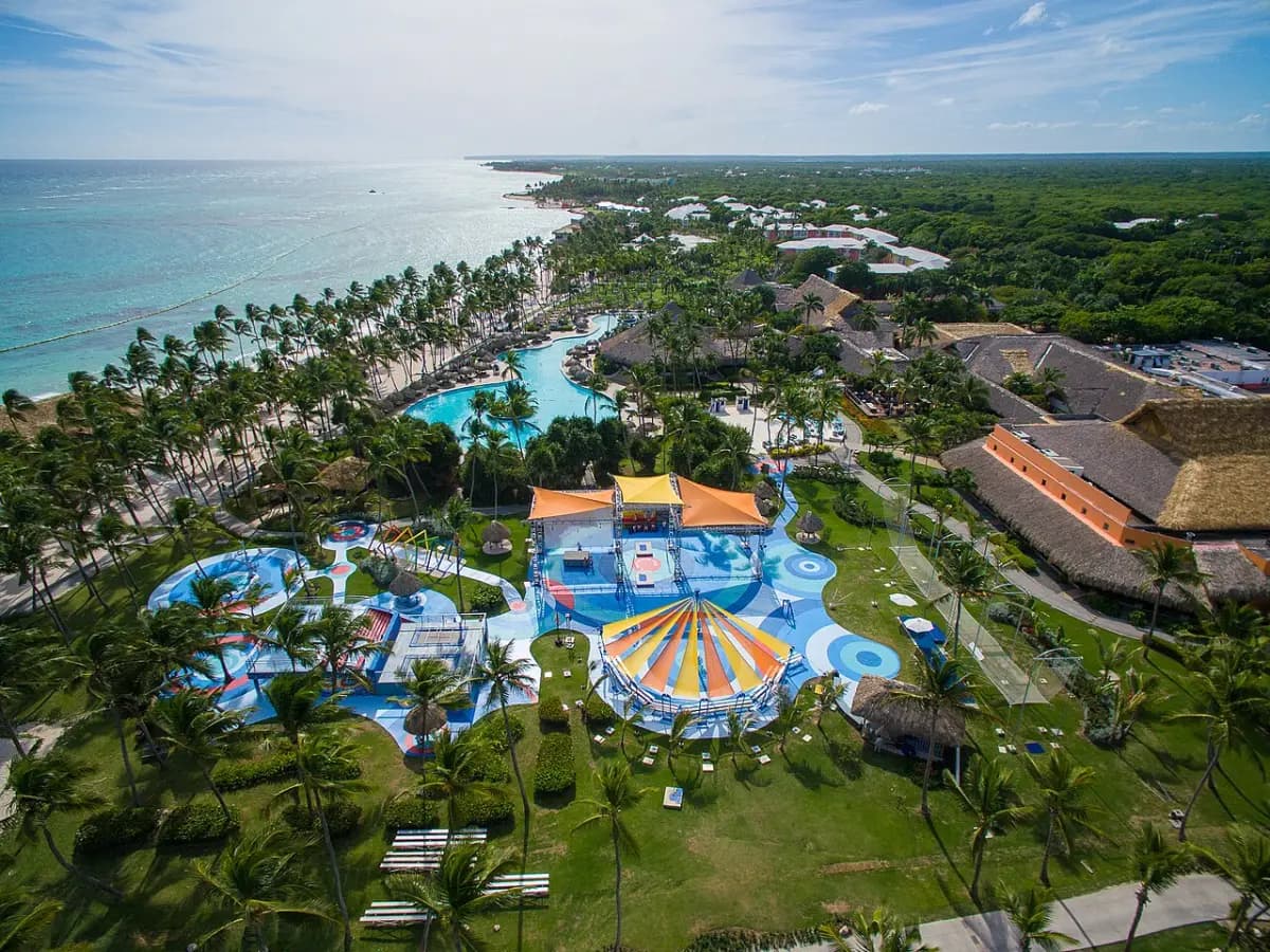 Aerial view of Club Med Punta Cana with colourful kids' pools, palms and the beach
