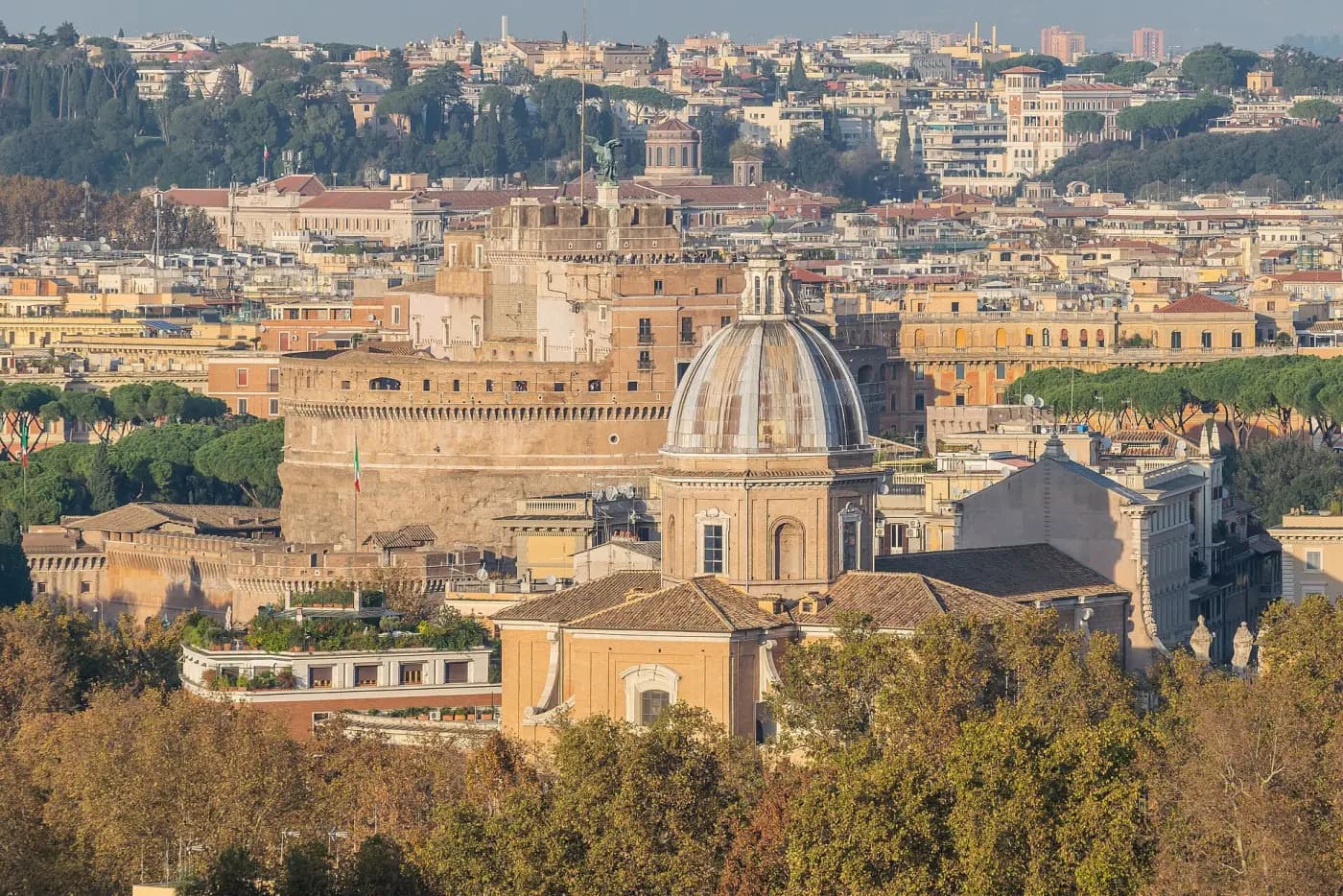 View from the Gianicolo hill over Rome's rooftops and domes toward Castel Sant'Angelo.